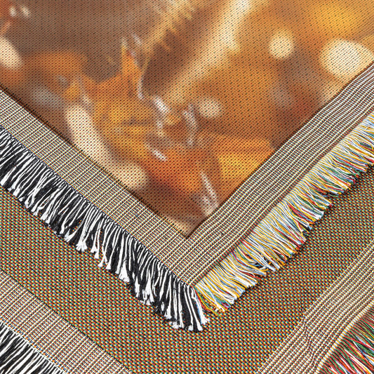 Orange Tabby Cat Surrounded by Glowing Autumn Leaves Under Warm Afternoon Sun with Intricate Fur Details Woven Throw Blanket - Awakening Righteousness