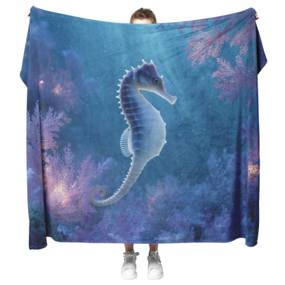 Blue_Eyed_Seahorse_Curled_Around_Glowing_H_Blanket_Model_Mockup.png