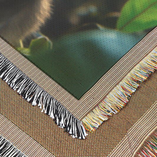 Joyful Baby Monkey in Sunlit Jungle with Vibrant Foliage Woven Throw Blanket Bringing Playful Energy and Natural Beauty to Your Home - Awakening Righteousness