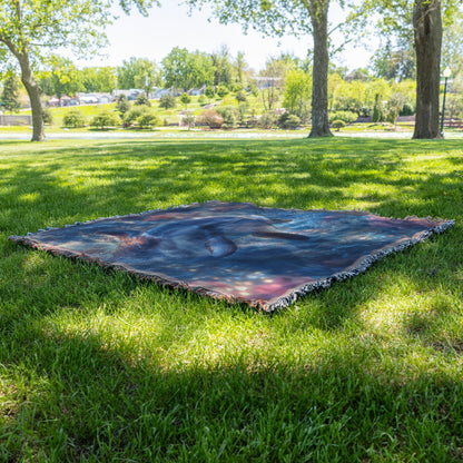 Baby Dolphin Swimming in Glowing Crystal Clear Ocean Water Filled with Magical Light and Pink Flowers Woven Throw Blanket - Awakening Righteousness