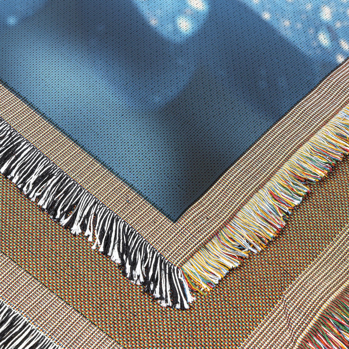 CloseUp of Dew Kissed Blue Flower with Vibrant Orange Center Woven Throw Blanket for Home Decor - Awakening Righteousness
