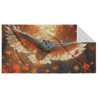 Owl with Luminous Golden Feathers Flying Through Vibrant Glowing Autumn Forest Under Warm Sunlight Beach Towel - Awakening Righteousness