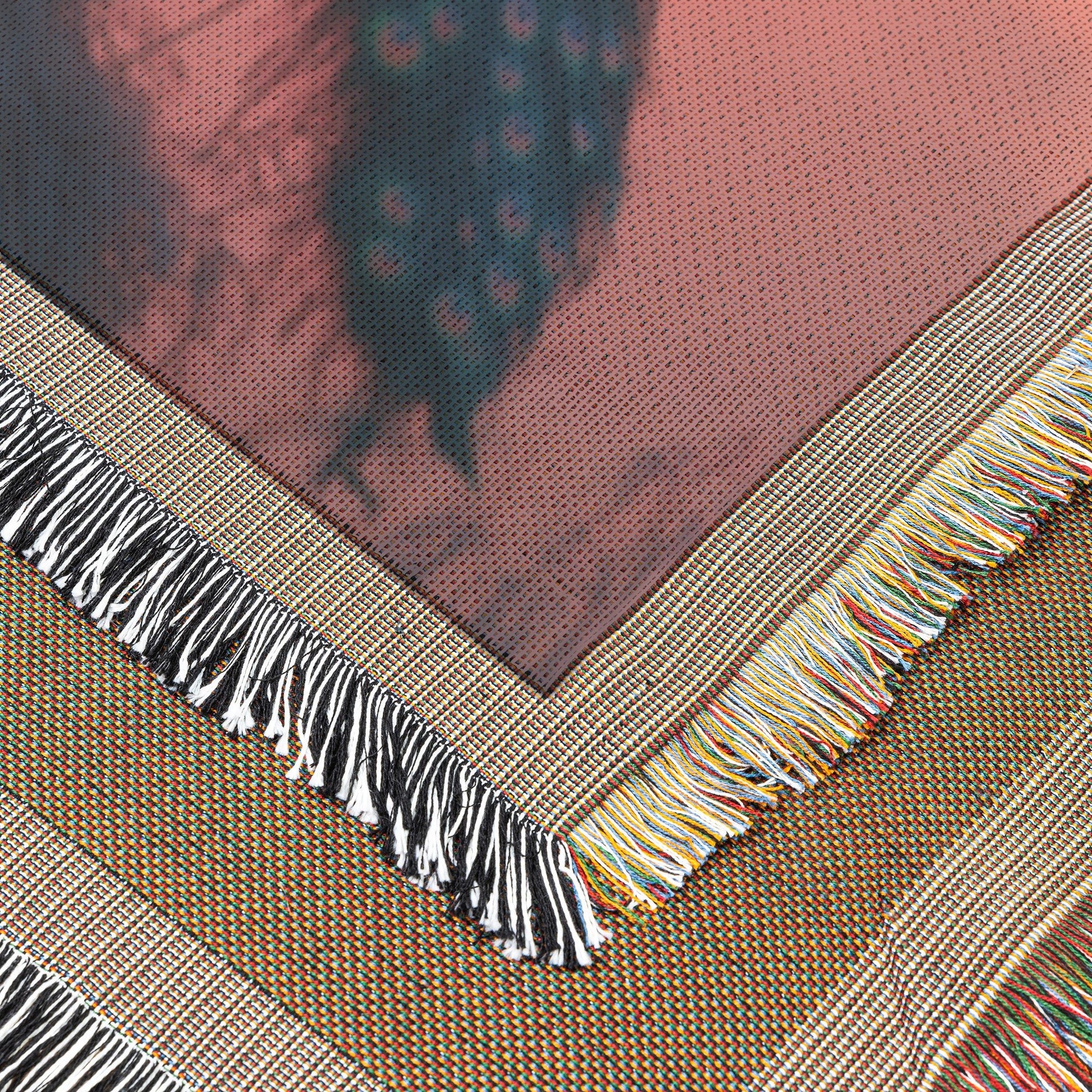 Peacock Silhouetted Against Golden Sunset on Hilltop with Soft Light Reflecting Vibrant Feathers Woven Throw Blanket - Awakening Righteousness