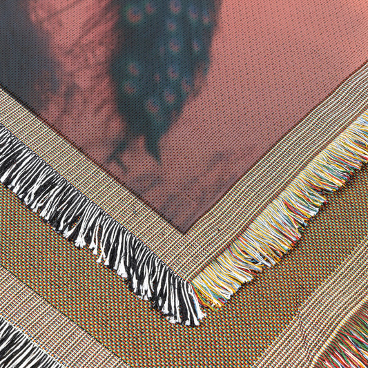 Peacock Silhouetted Against Golden Sunset on Hilltop with Soft Light Reflecting Vibrant Feathers Woven Throw Blanket - Awakening Righteousness
