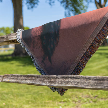 Peacock Silhouetted Against Golden Sunset on Hilltop with Soft Light Reflecting Vibrant Feathers Woven Throw Blanket - Awakening Righteousness