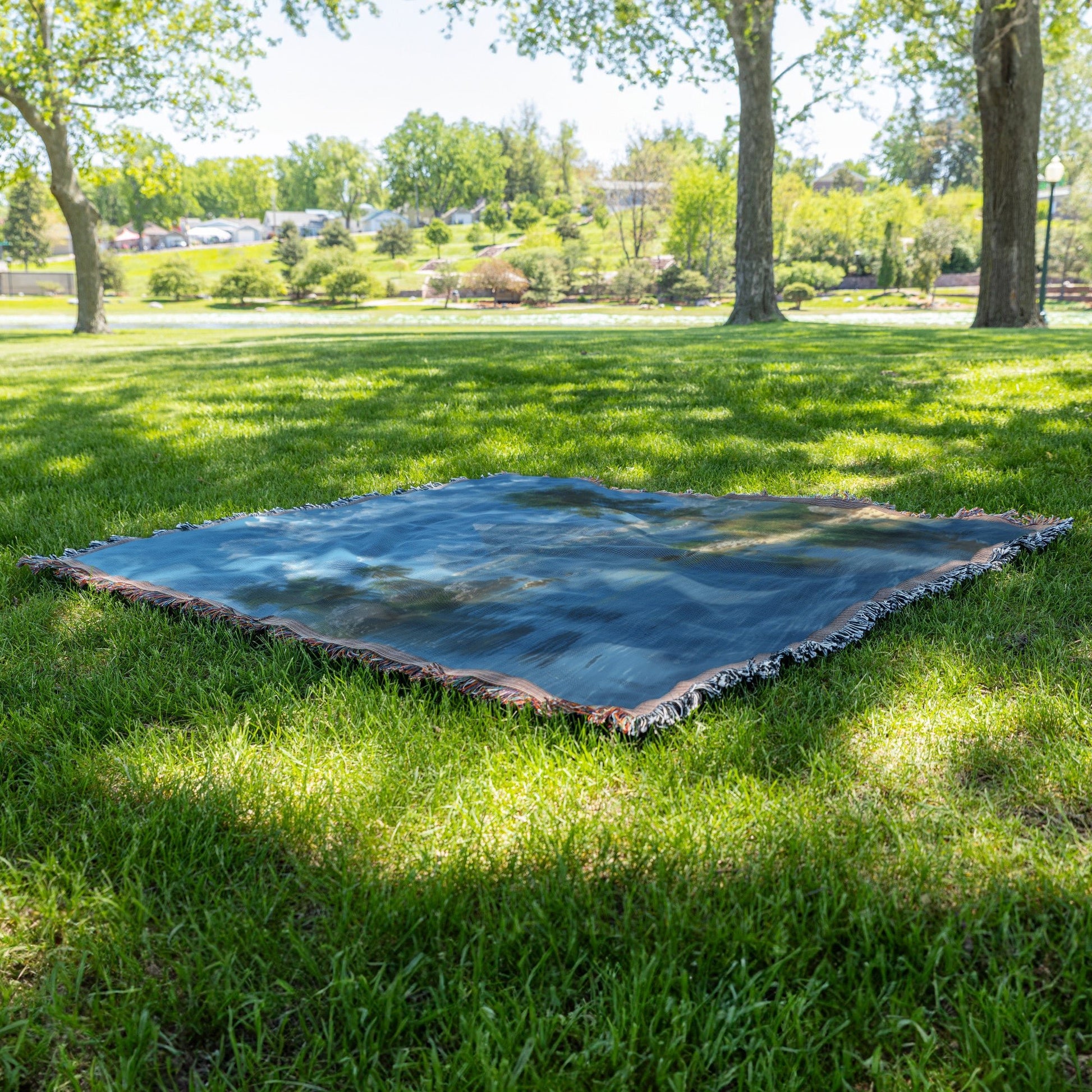 Pyramids and Palm Trees by the River with Clear Blue Sky for Woven Throw Blanket - Awakening Righteousness