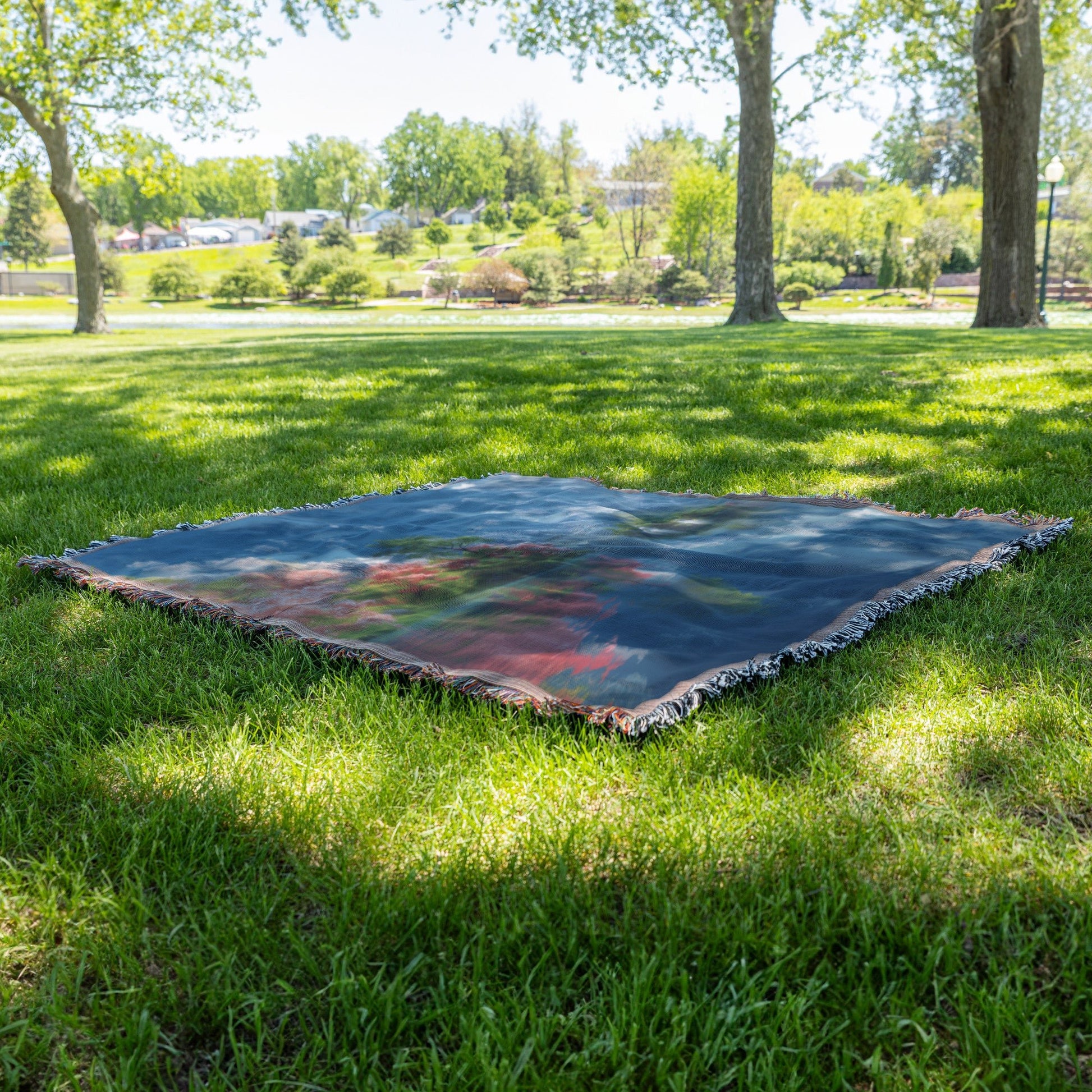 Serene Mountain Lake with Blooming Trees Woven Throw Blanket - Awakening Righteousness